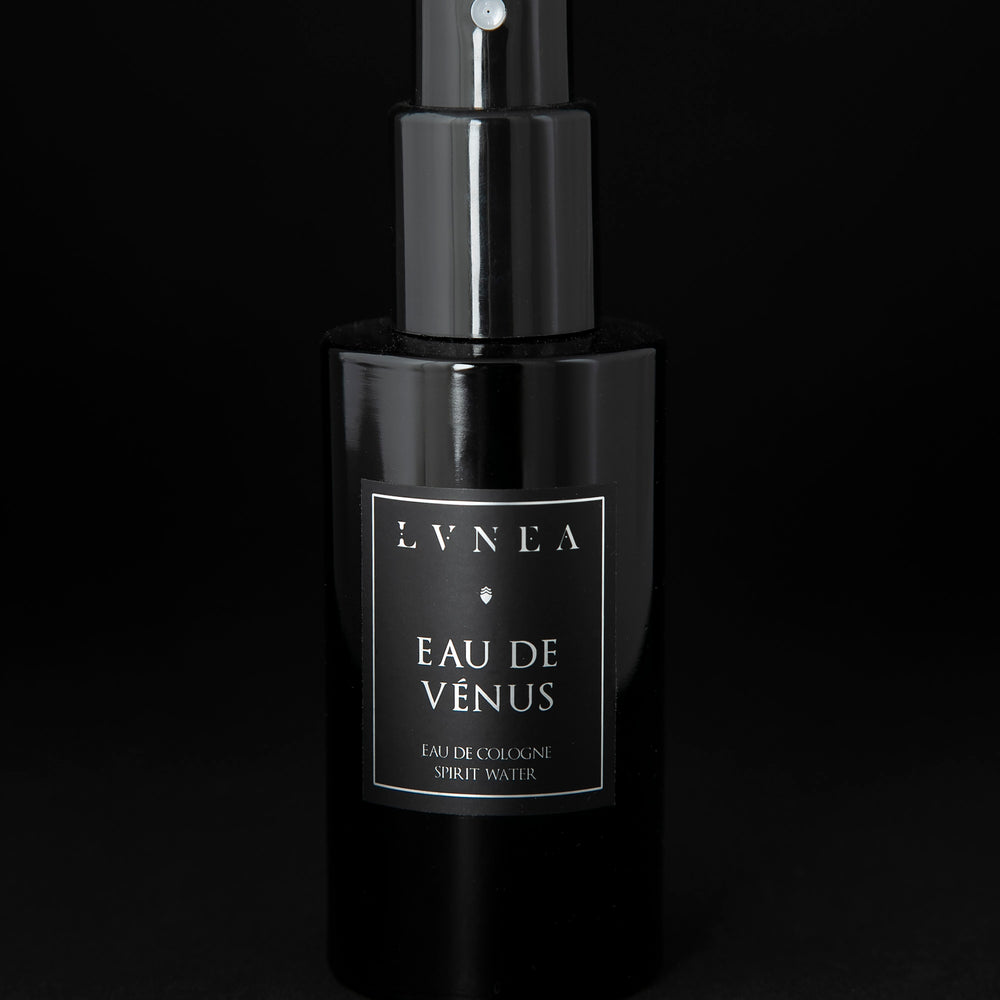 100ml black glass bottle of LVNEA’s Eau de Venus natural fragrance on black background