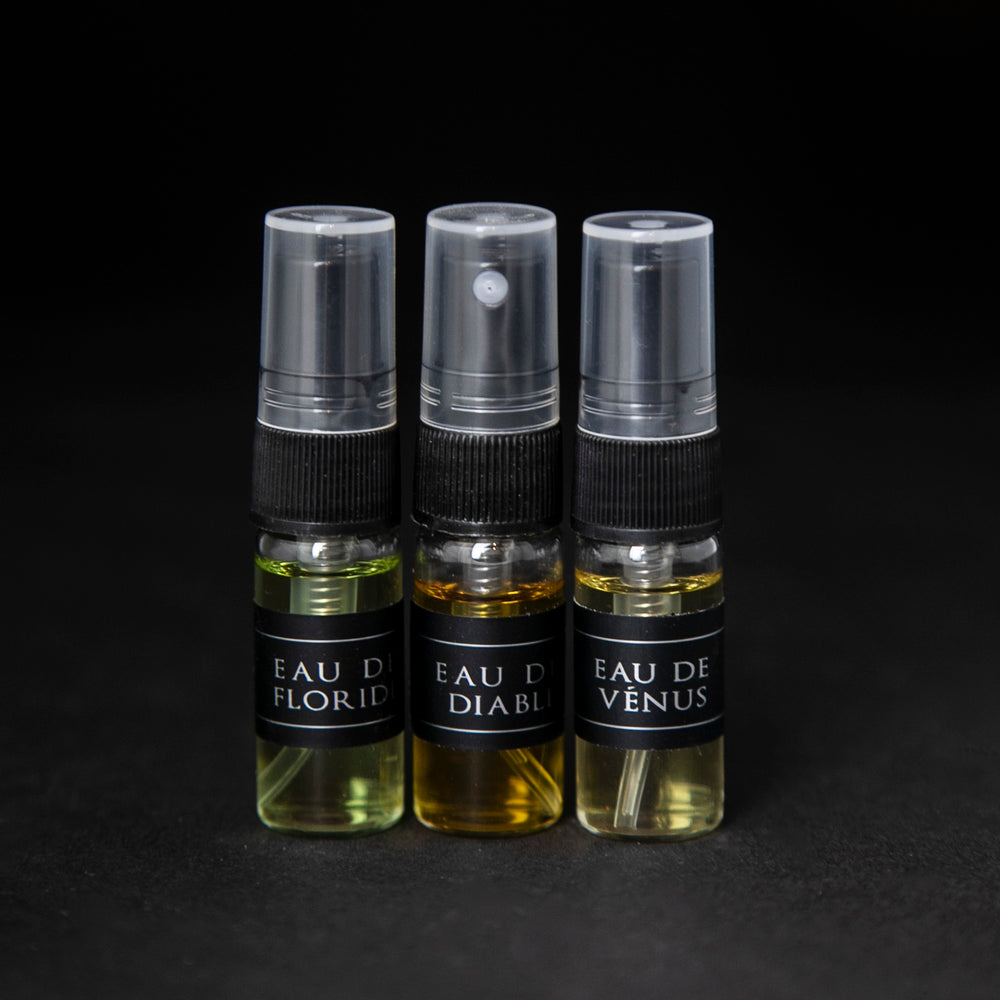 Full sample set of LVNEA's Eau de Cologne collection on black background. Includes Eau de Floride, Eau du Diable and Eau de Venus, each in a 3ml glass spray top bottle. 