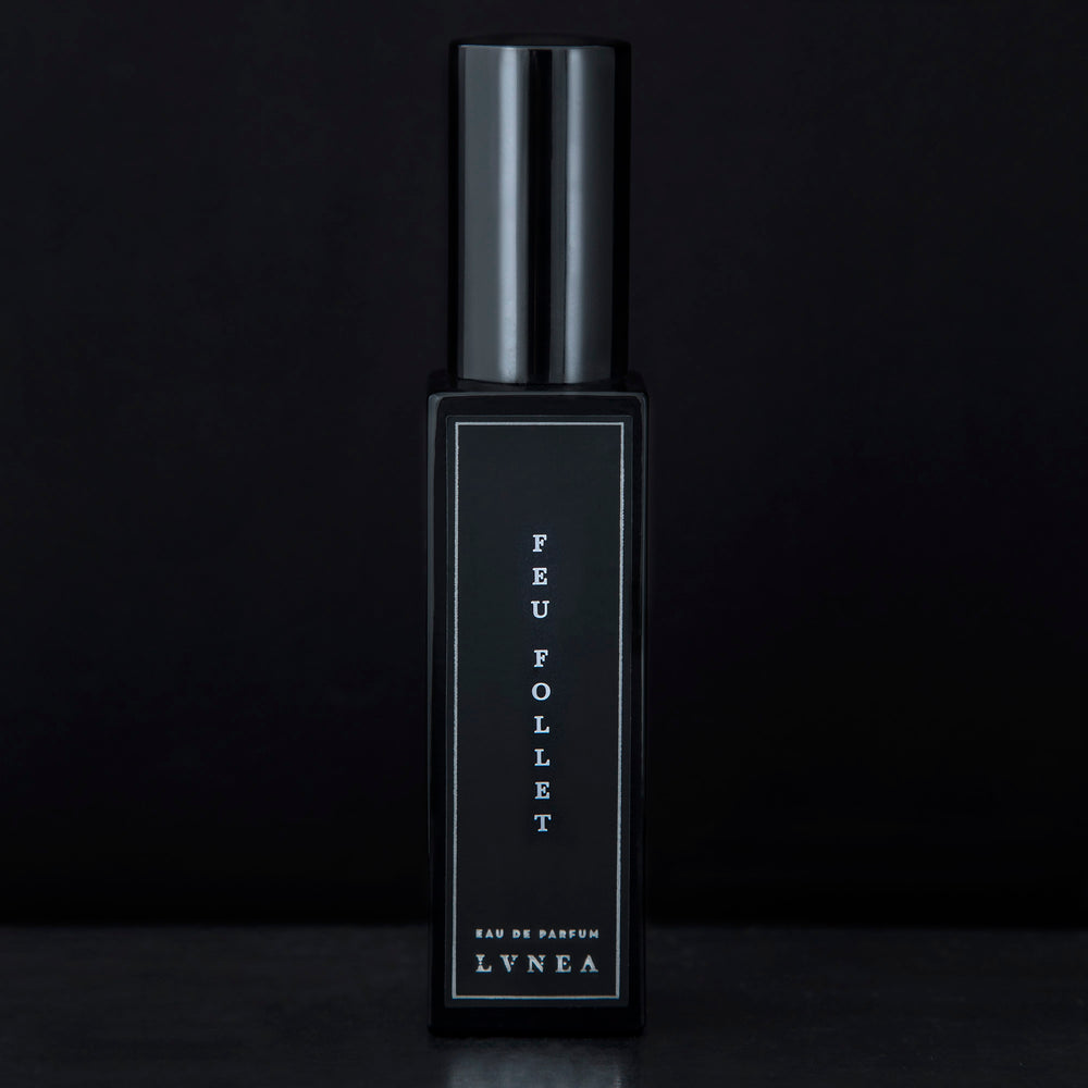 30ml black glass bottle of LVNEA’s Feu Follet natural perfume on black background