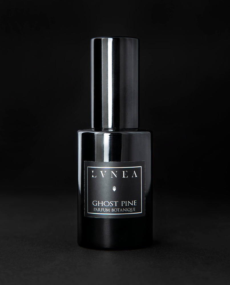 30ml black glass bottle of LVNEA best-selling natural perfume Ghost Pine on black background