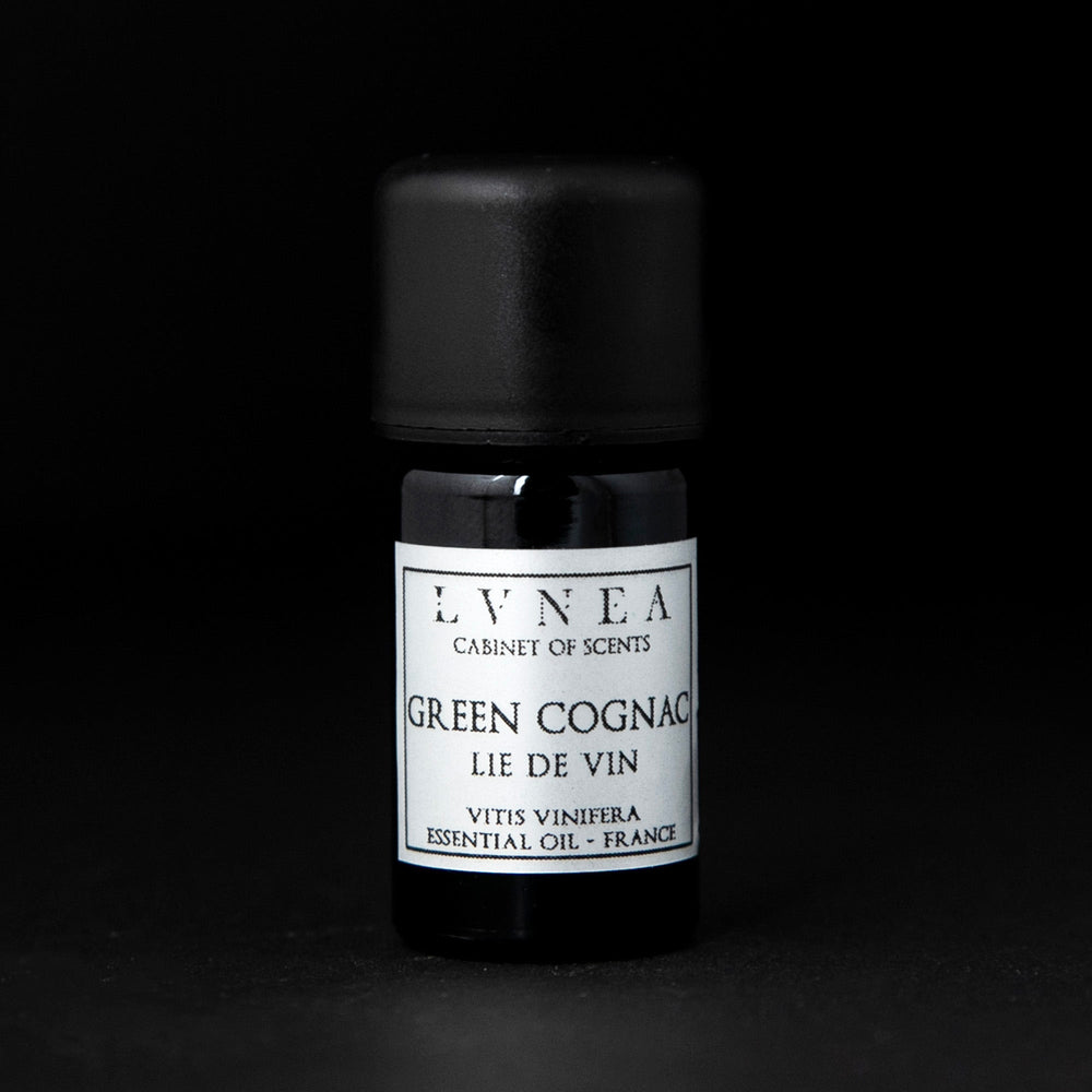 5ml black glass bottle with silver label of LVNEA's green cognac essentail oil on black background