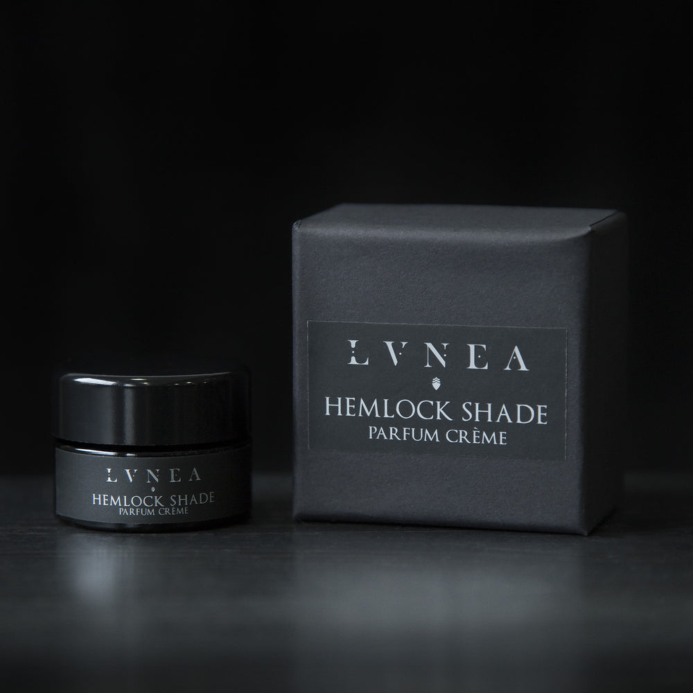
                      
                        10g black glass jar of LVNEA's Hemlock Shade solid perfume and its box on black background
                      
                    