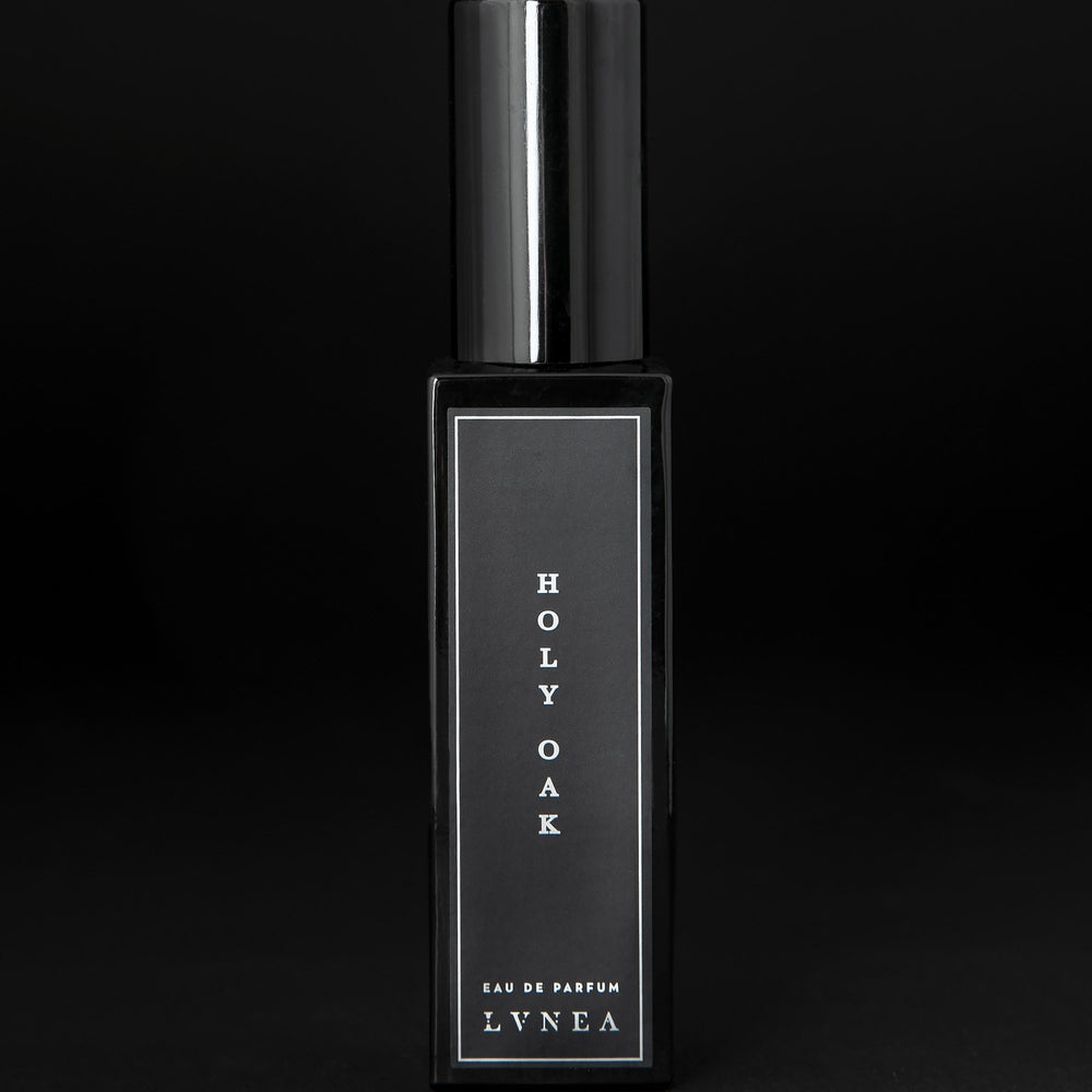 30ml black glass bottle of LVNEA’s Holy Oak natural perfume on black background