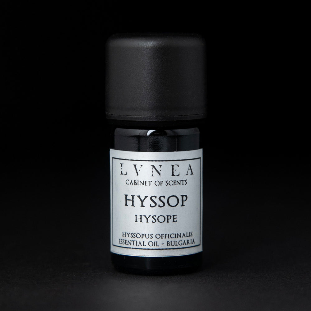 5ml black glass bottle of LVNEA's hyssop essential oil on black background. The label on the bottle is silver.