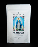 Resealable white pouch of The New New Age's "The Immaculate Heart of Mary" herbal tea. There is an image of Mother Mary surrounded by roses on the front of the bag.