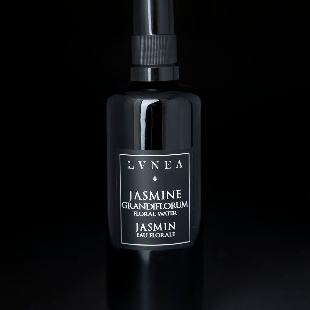 100ml black glass bottle of LVNEA's Jasmine Hydrosol on black background