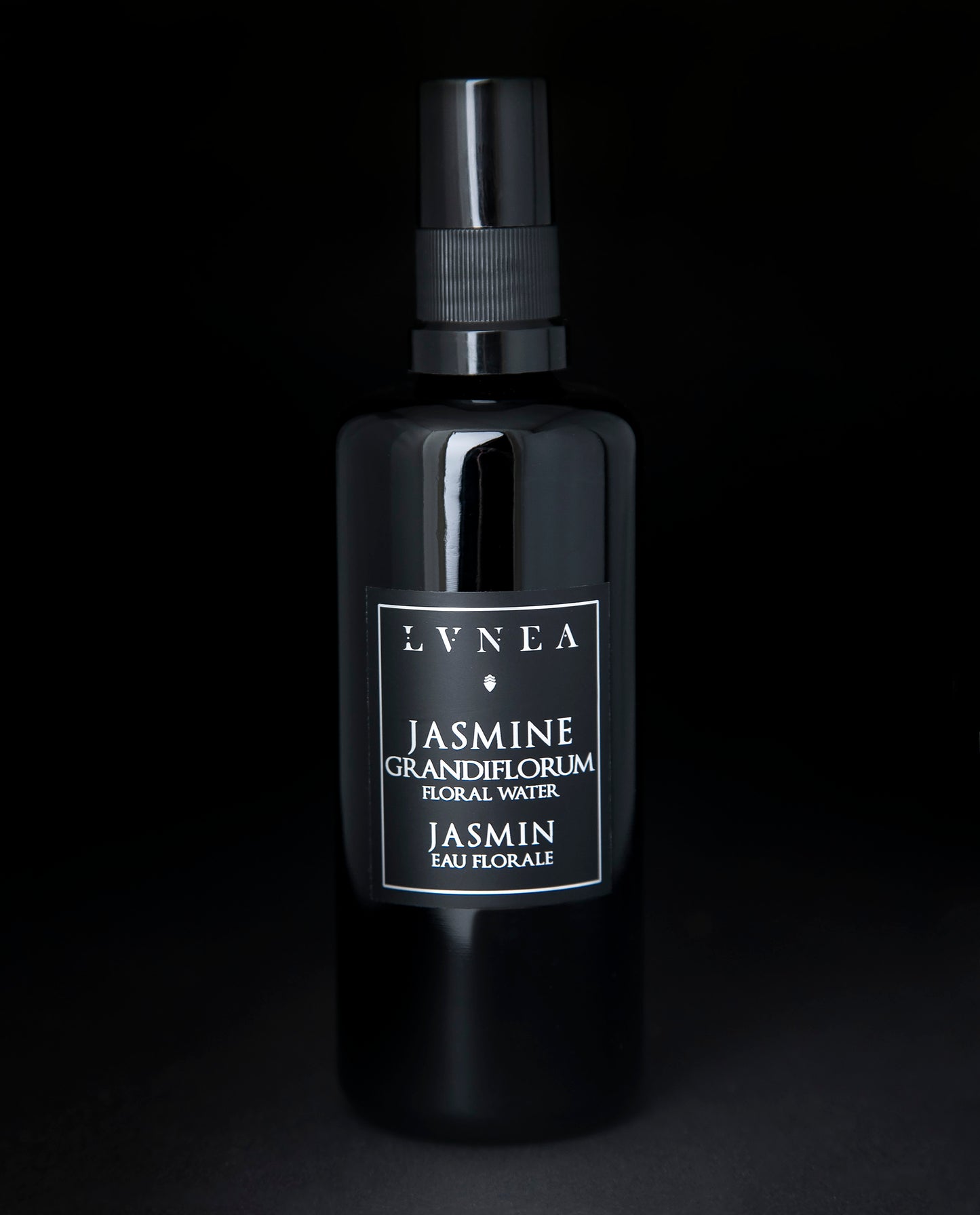 100ml black glass bottle of LVNEA's Jasmine Hydrosol on black background
