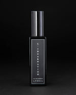 30ml black glass bottle of LVNEA’s L'Incarnation natural perfume on black background