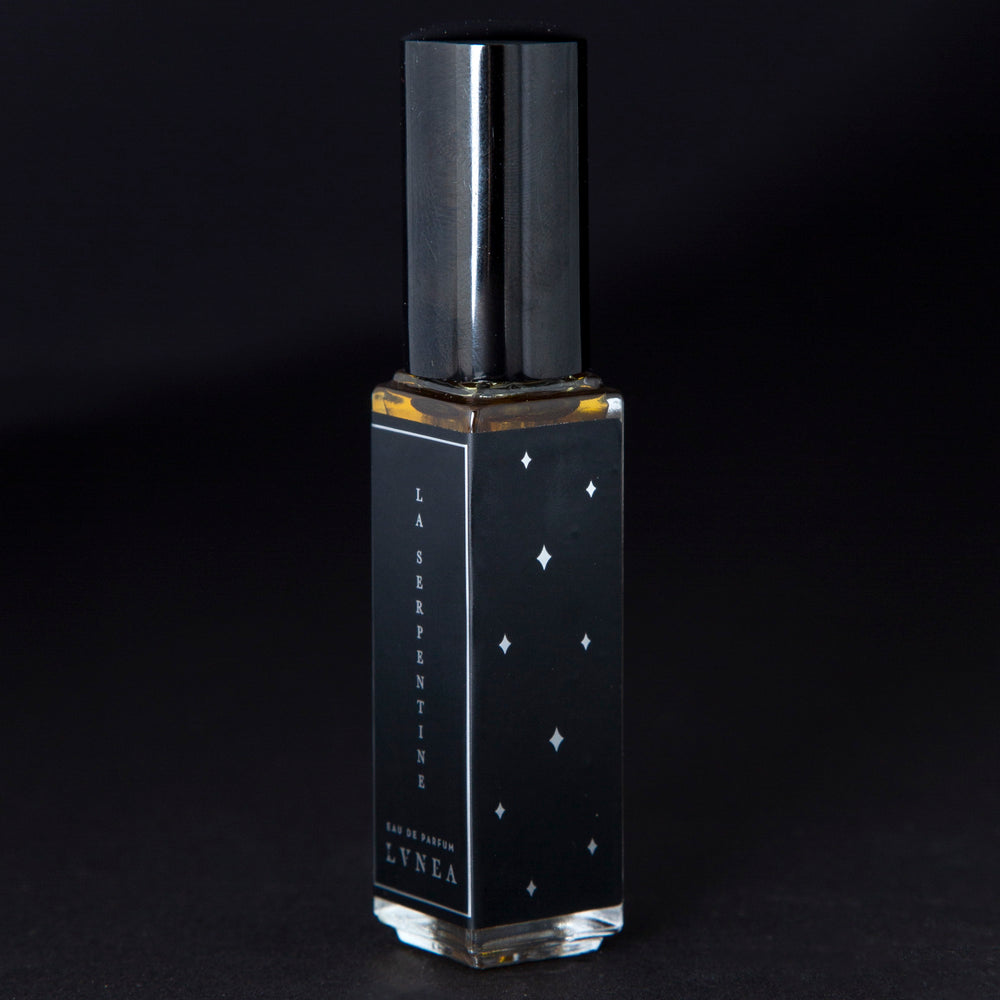 
                      
                        A fruity, leathery, unisex chypre fragrance by natural and botanical perfume brand LVNEA with notes of peach, osmanthus, patchouli, labdanum, and oakmoss. Presented in a 8ml star-spangled black glass bottle, the label reads LA SERPENTINE EAU DE PARFUM.
                      
                    