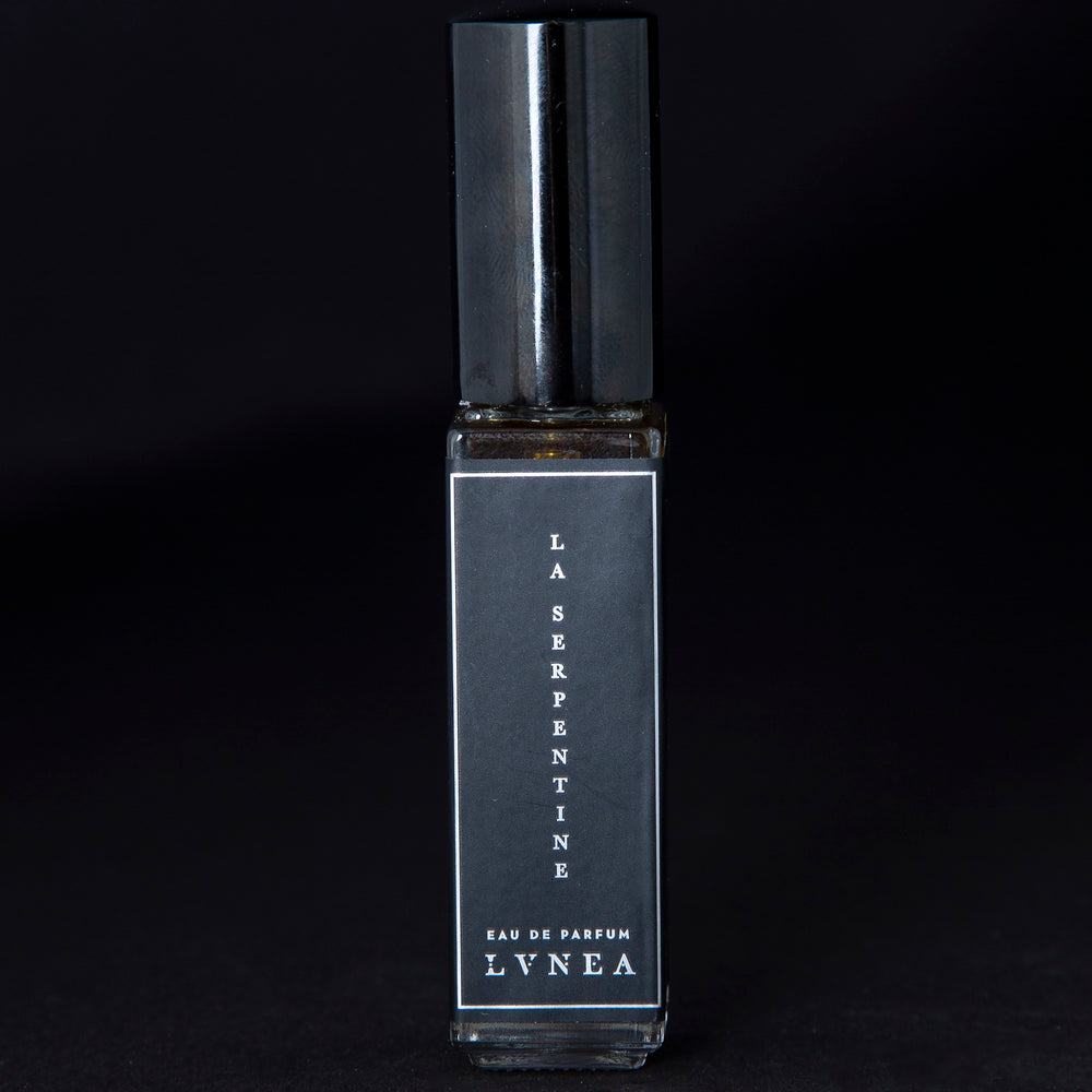 
                      
                        8ml clear glass bottle of LVNEA’s La Serpentine natural perfume on black background
                      
                    