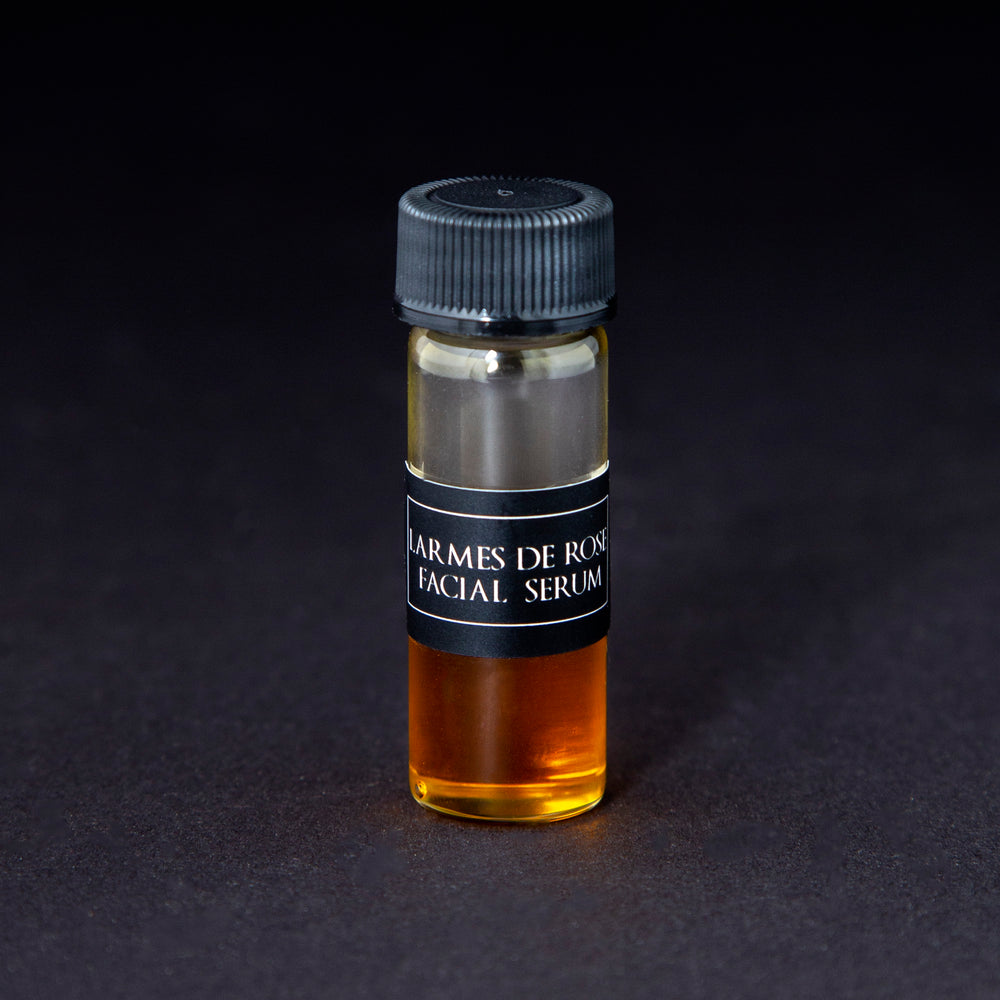 2ml clear glass sample vial of LVNEA's Larmes de Rose Facial Serum on black background