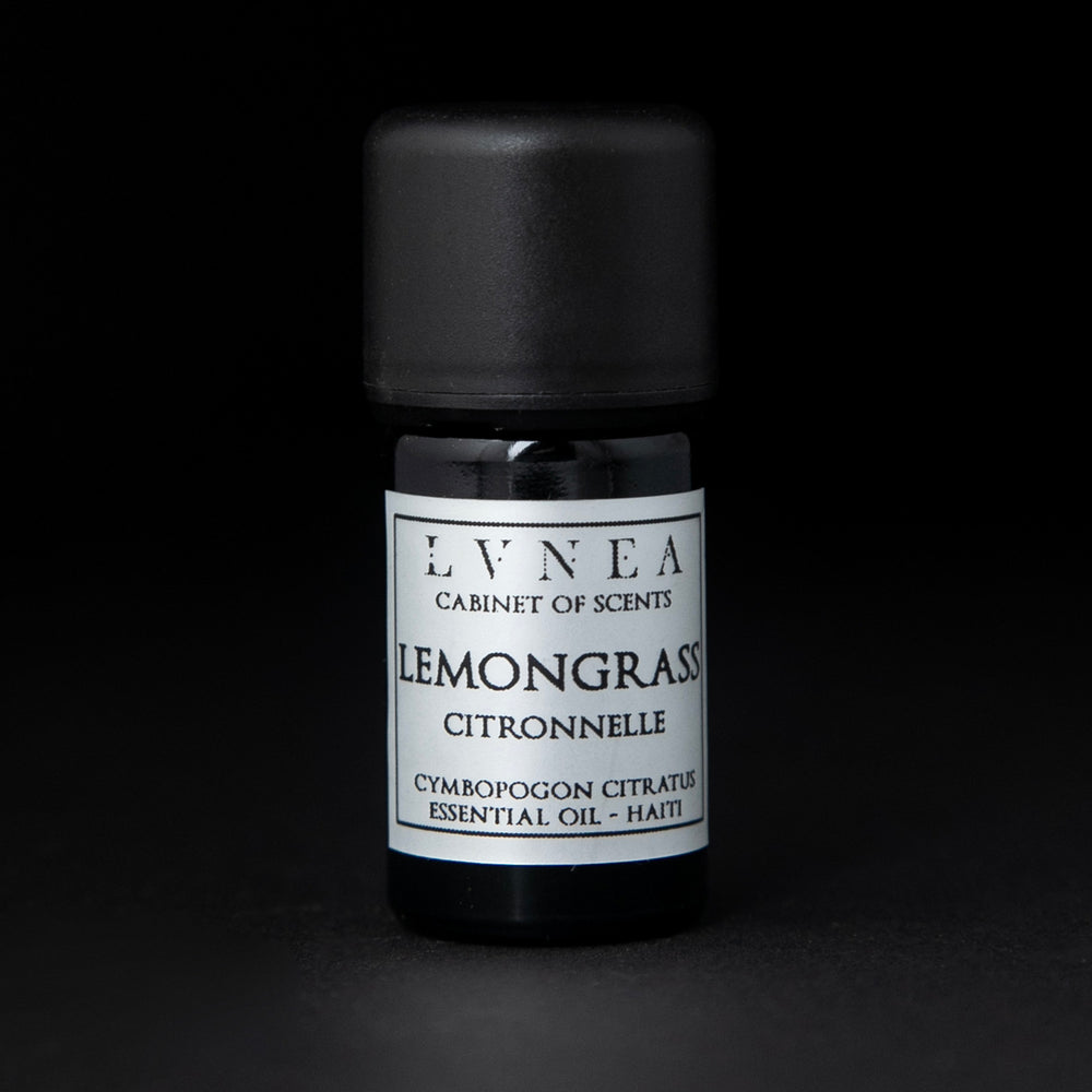 5ml black glass bottle of LVNEA's lemongrass essential oil on black background. The label on the bottle is silver.