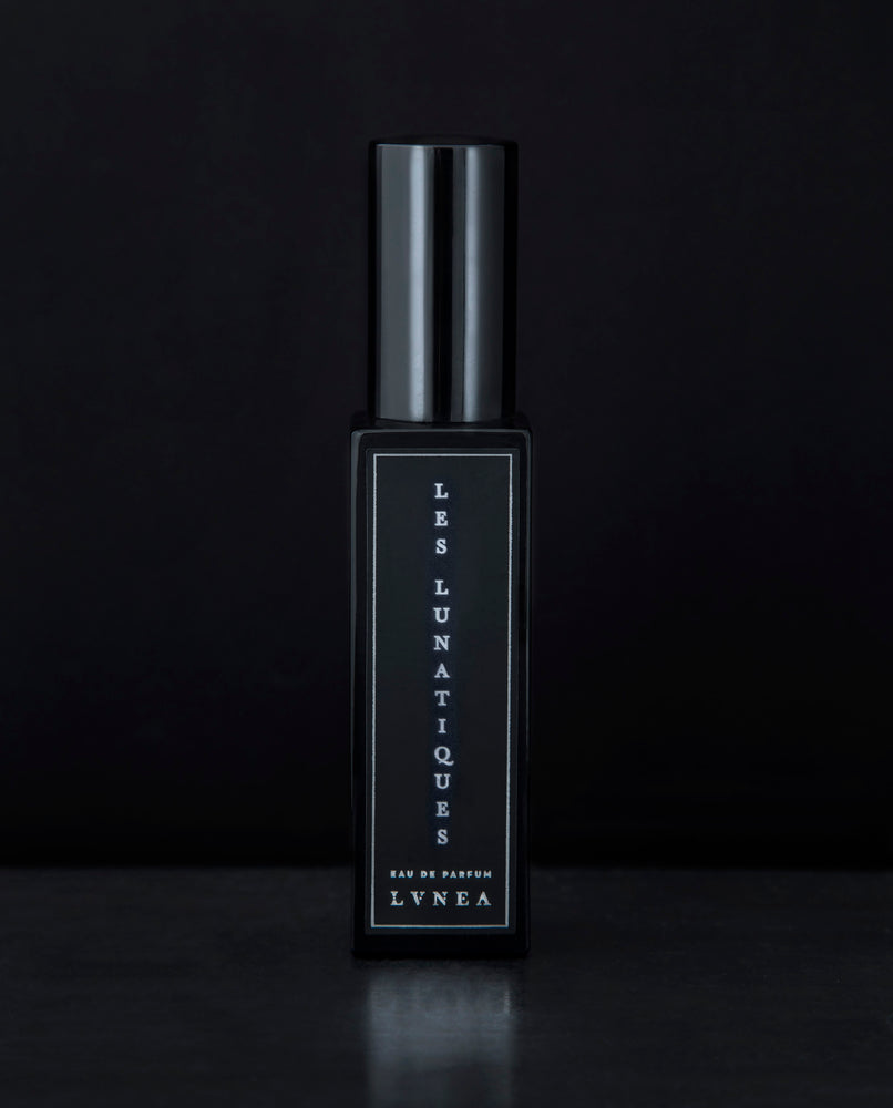 30ml black glass bottle of LVNEA’s Les Lunatiques natural perfume on black background