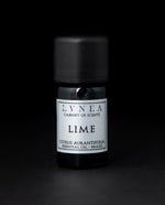 5ml black glass bottle of LVNEA's lime essential oil on black background. The label on the bottle is silver.