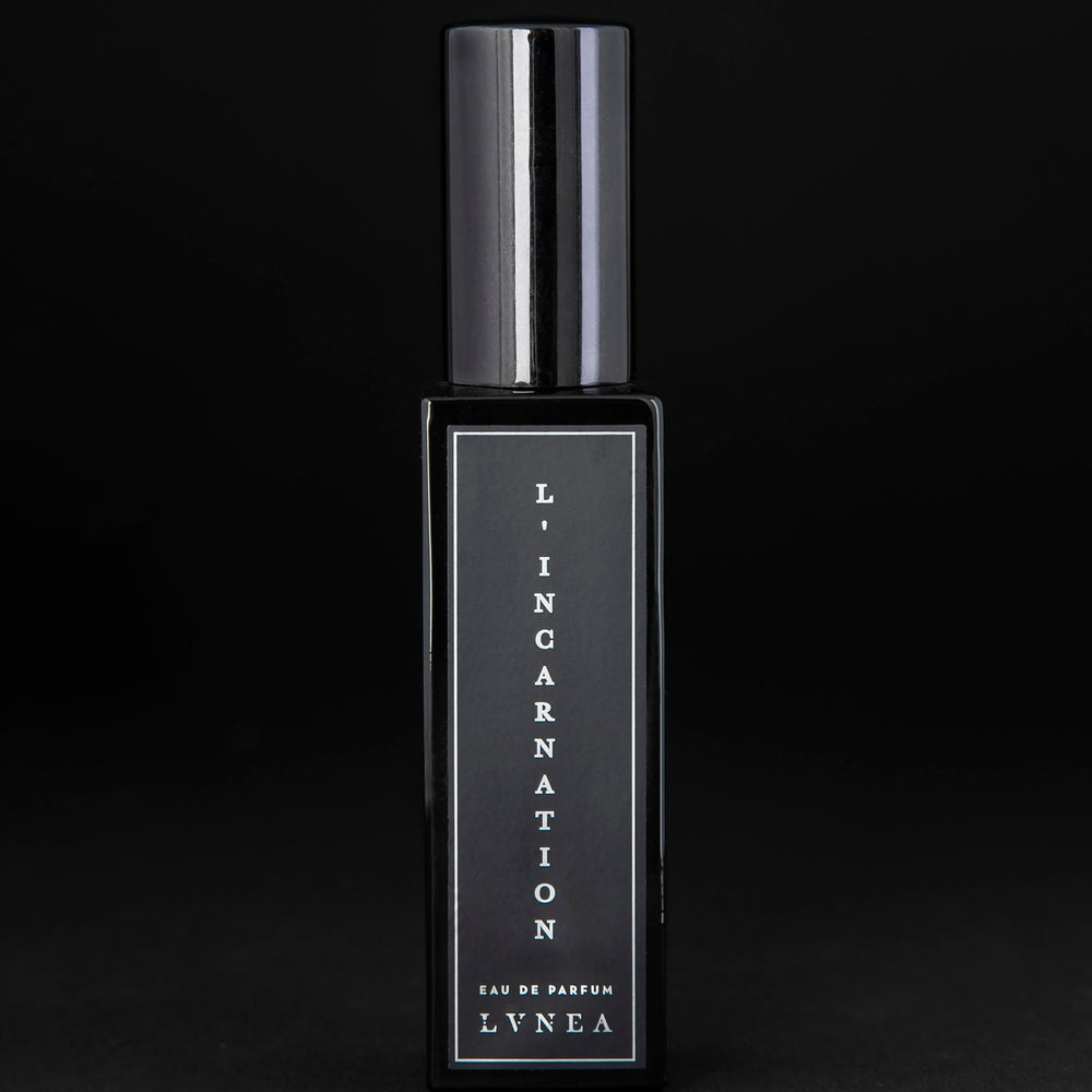 30ml black glass bottle of LVNEA’s L'Incarnation natural perfume on black background