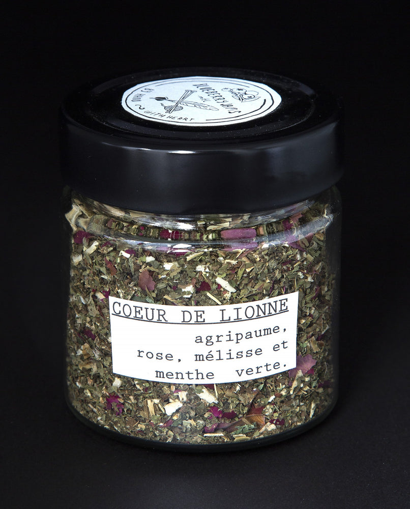 Clear glass jar filled with a herbal tea blend by blueberryjams.