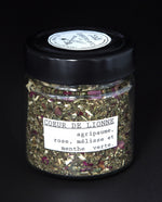 Clear glass jar filled with a herbal tea blend by blueberryjams.