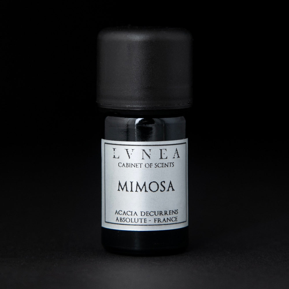 5ml black glass bottle of LVNEA's mimosa absolute on black background. The label on the bottle is silver.