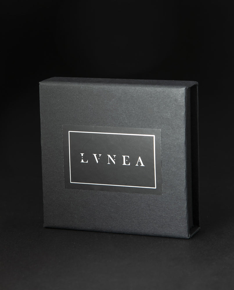 LVNEA eau de parfum sample set box with lid closed on black background 