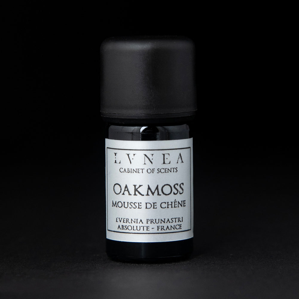 5ml black glass bottle of LVNEA's oakmoss absolute on black background. The label on the bottle is silver.