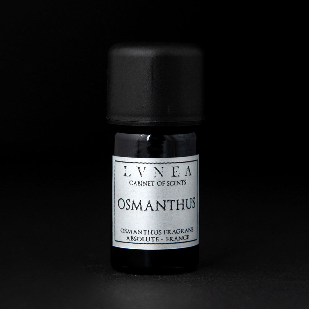 5ml black glass bottle of LVNEA's osmanthus absolute on black background. The label on the bottle is silver.