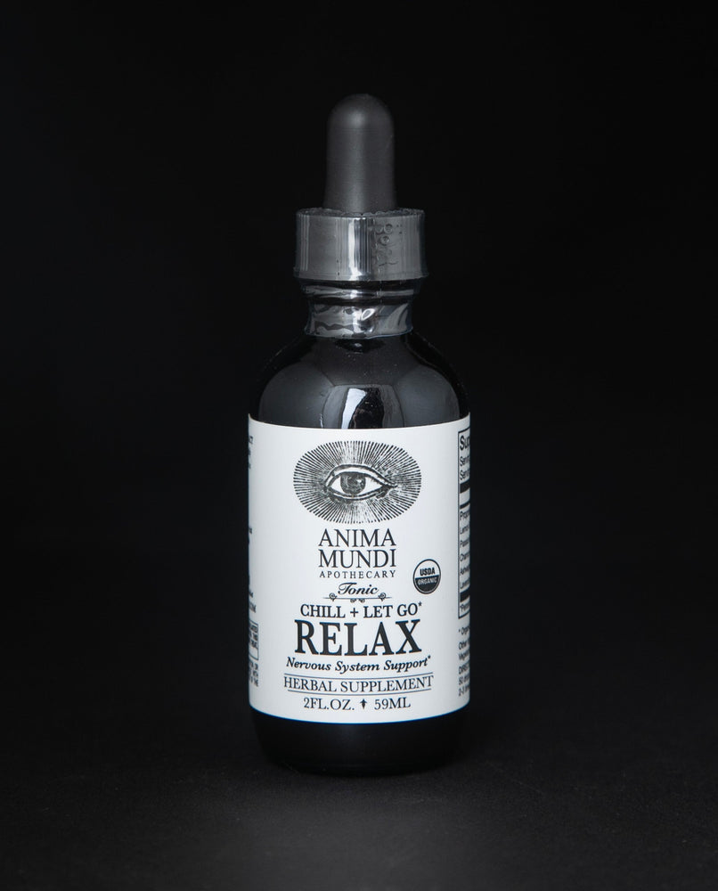 Black glass bottle with dropper top of Anima Mundi's "Relax" herbal tincture.