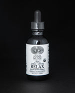 Black glass bottle with dropper top of Anima Mundi's "Relax" herbal tincture.