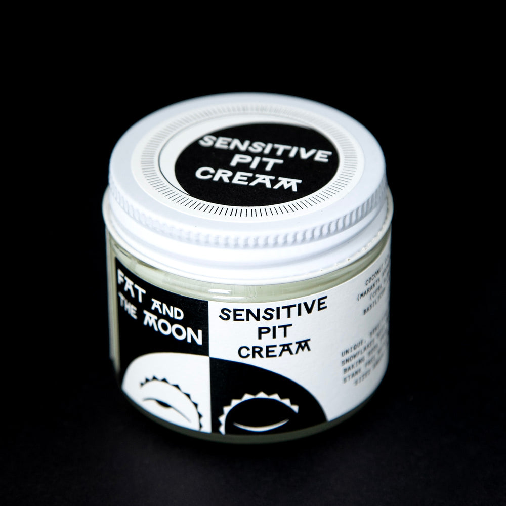 clear glass pot of Fat and the Moon's "Sensitive Pit Cream" deodorant