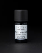 5ml black glass bottle of LVNEA's sweet orange essential oil on black background. The bottle has a silver label.