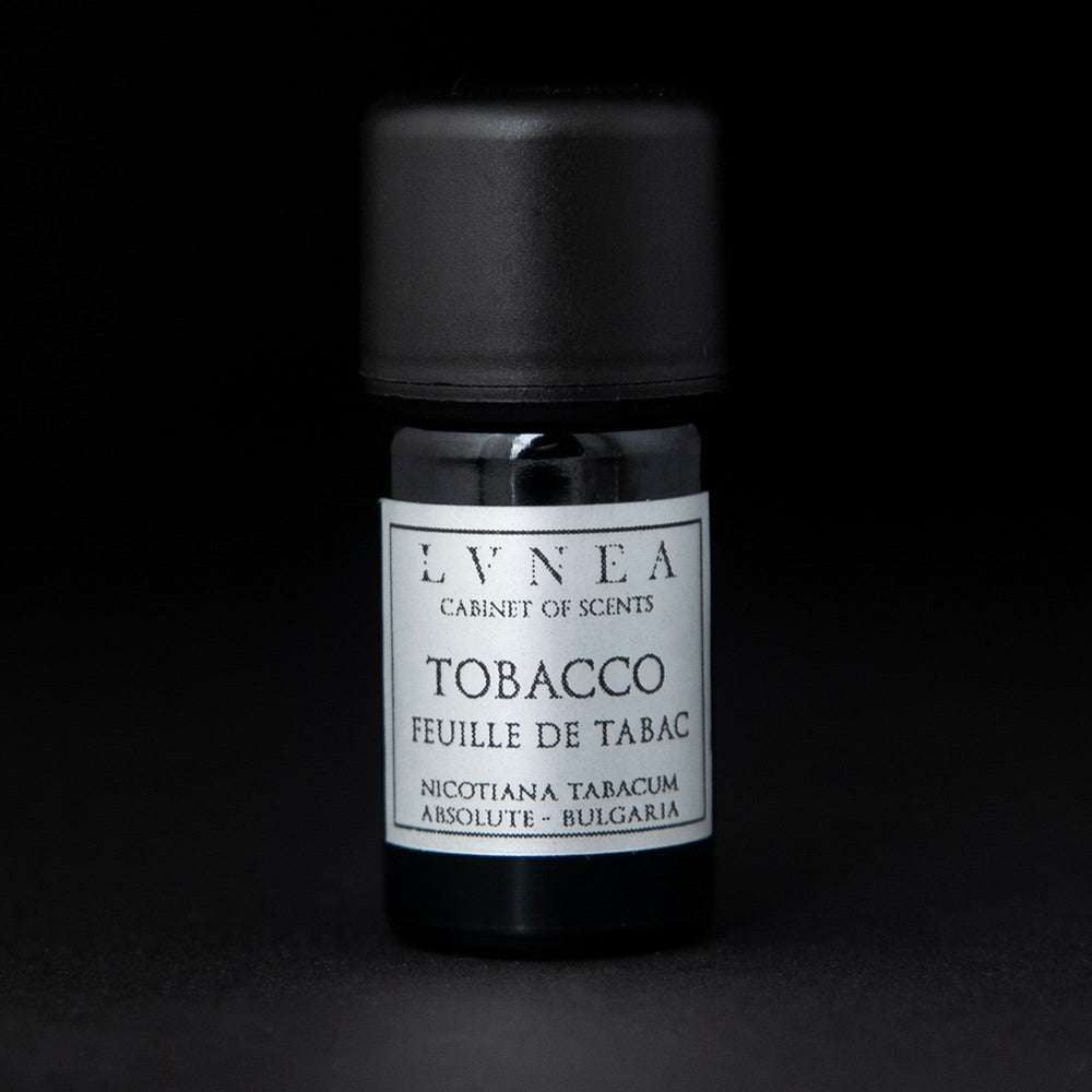 
                      
                        5ml black glass bottle of LVNEA's tobacco absolute on black background. The label on the bottle is silver.
                      
                    