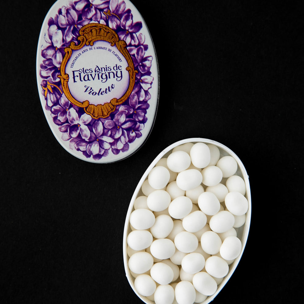 White and purple metal tin of Anis de Flavigny bonbons.
